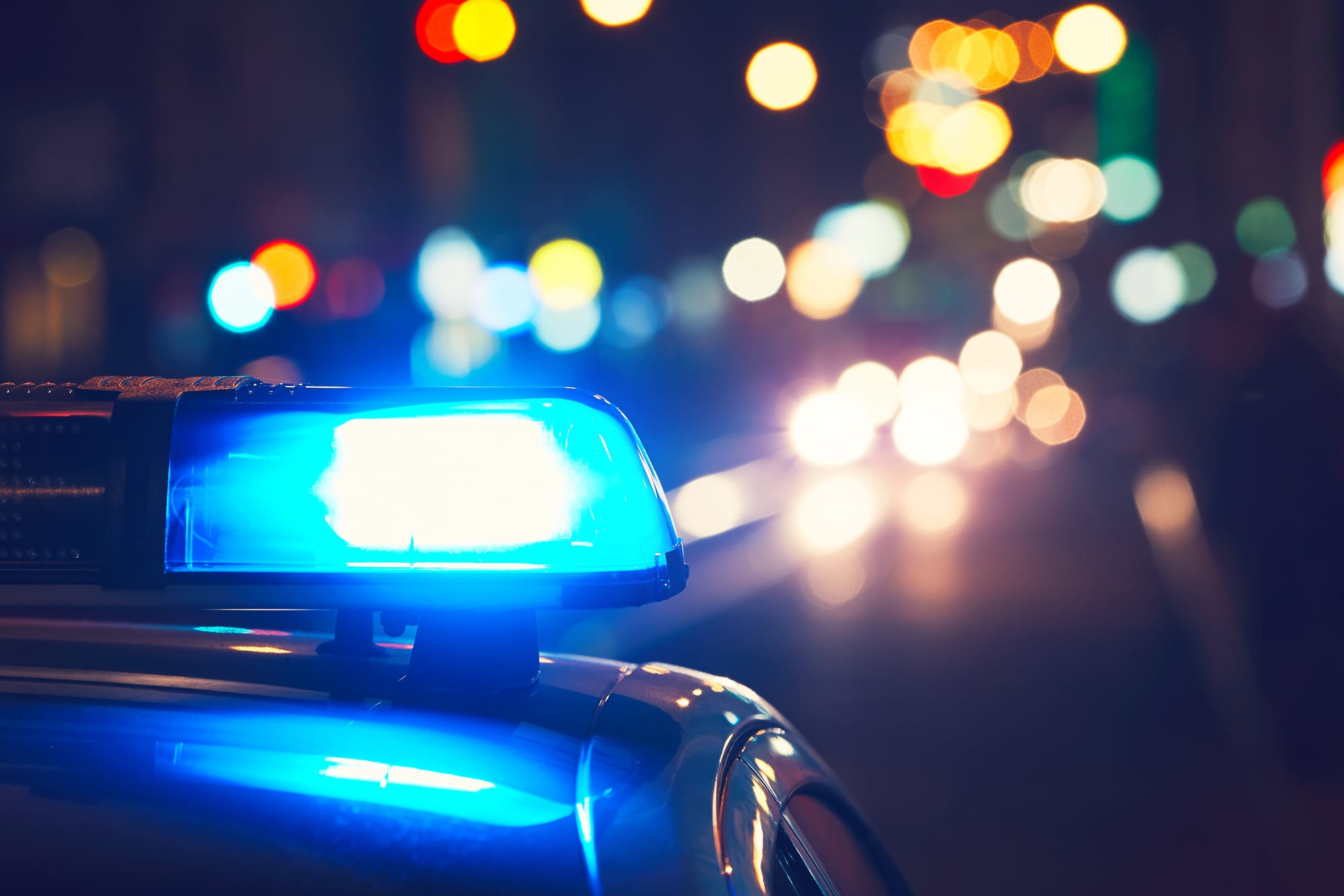 Police cruiser emergency lights at night